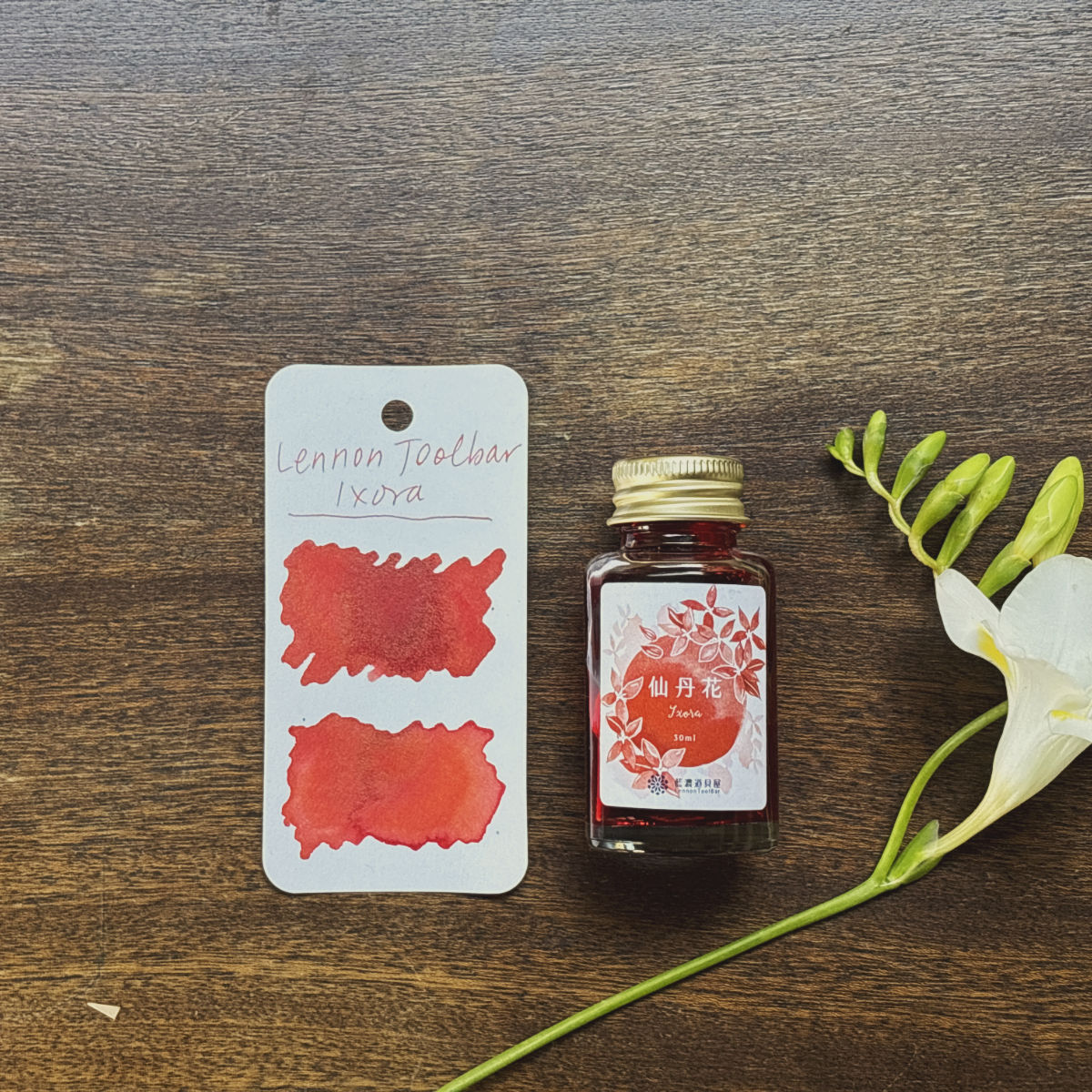 Lennon Toolbar Ixora Swatch and bottle
