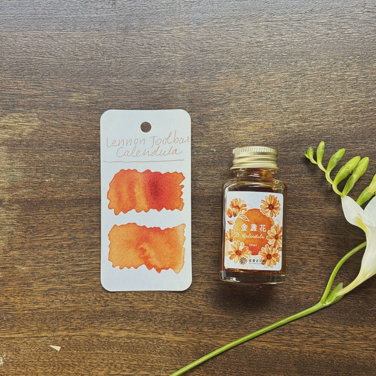 Lennon Toolbar Calendula swatch and ink bottle